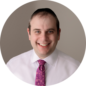 A man wearing a white shirt and purple tie